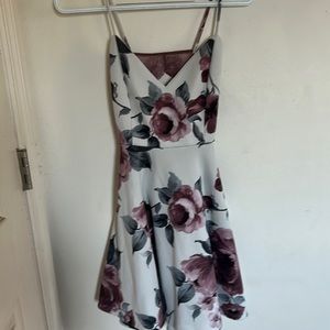 Floral mini dress with adjustable straps.